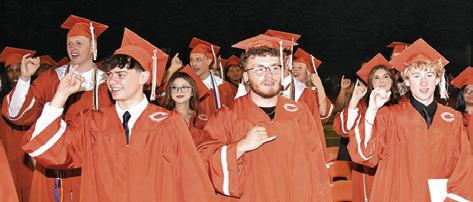 CALDWELL HIGH SCHOOL graduates sing the school song for the final time during the Friday commencement ceremony.