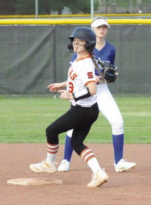 AUBREY FLENCHER makes it to second base during the Snook-Somerville game last Tuesday. Also pitctured is Snook’s Kaylie Holden.
