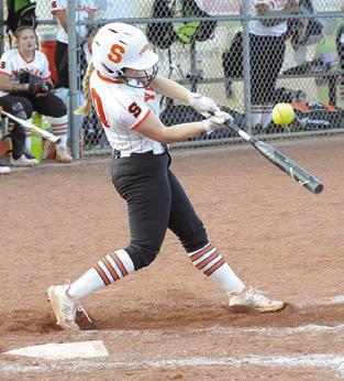 ABIGAIL FLENCHER hits a pop up to short during the Snook-Somerville game last week.