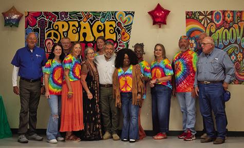 BURLESON HEALTH RESOURCE Center staff and supporters gather around Albert Ramirez to celebrate his retirement after 22 years of service. Tribune photo by Sabine Lazo