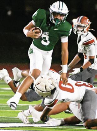 ROGELIO HERNANDEZ dives for a tackle last Friday against Franklin. Tribune photo by Denise Squier
