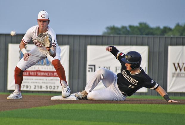 RYAN SEE GETS READY to catch the ball at second base against Giddings. The Hornets won 7-2 to clinch at least a share of the district title. -- Tribune photo by Roy Sanders