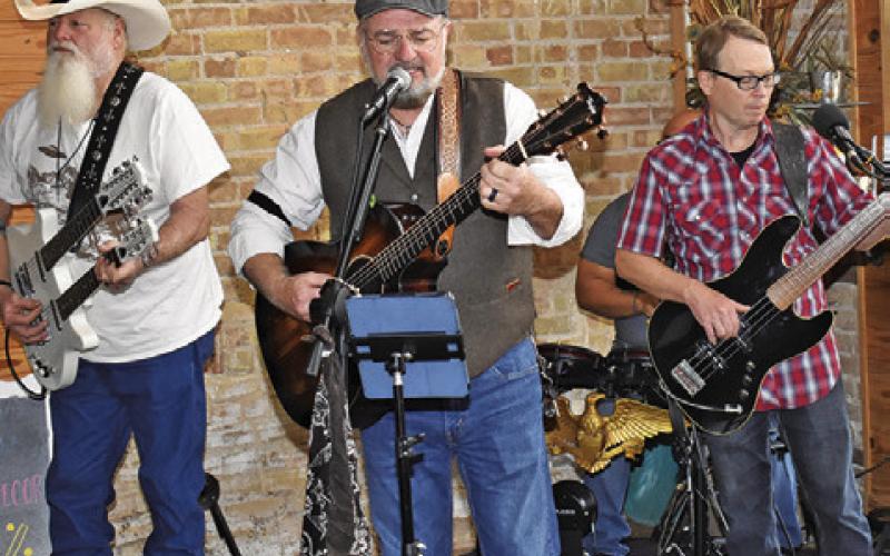 THE RED DIRT Ramblers perform on Saturday during the Chocolate, Champagne &amp;amp; Cake Walk in downtown Caldwell.