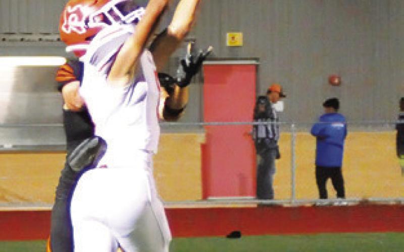 CALDWELL’S DYLAN Carter intercepts a pass against Smithville last Friday in Smithville. -- Tribune photo by Denise Squier