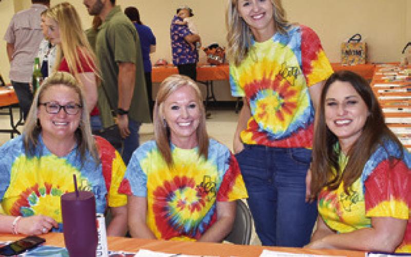 CARRIE SIMS, KRISTI Splawn, Krista Zwernemann and Jill Becka work on Friday at the Caldwell Education and Leadership Foundation (CELF) shrimp and crawfish dinner fundraiser. Tribune photo by Roy Sanders