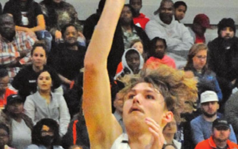 JOHNNY LEGG SHOOTS for two of his 19 points during the Somerville-Hearne area playoff game last Friday in Bryan.
