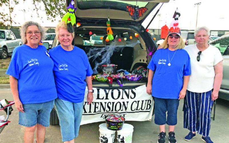 THE LYONS EXTENSION Club handed out candy to trick or treaters at Somerville’s Trunk or Treat. Pictured are Tammy Qualls-Tucker, Sharon Stevenson, Teri Sissoms and Francis Rutledge. Photo courtesy of Lyons Extension Club