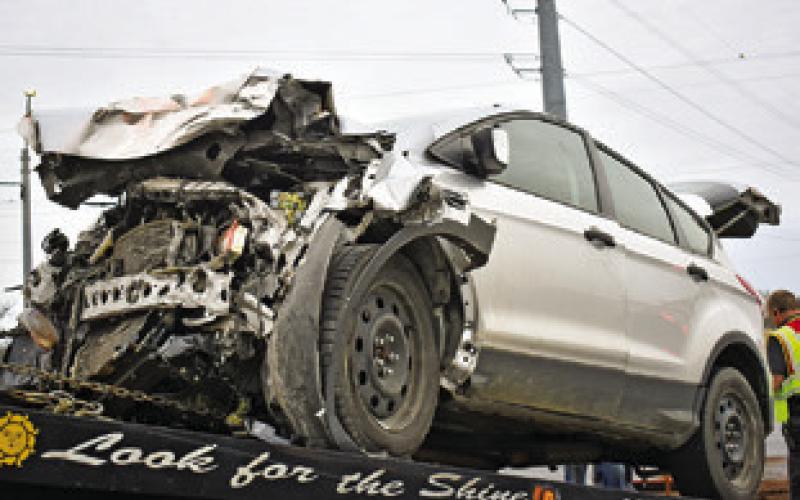 THIS FORD ESCAPE car was damaged on Feb. 27 in an accident at the intersection of State Highway 21 East and F.M. 50. Tribune photo by Roy Sanders