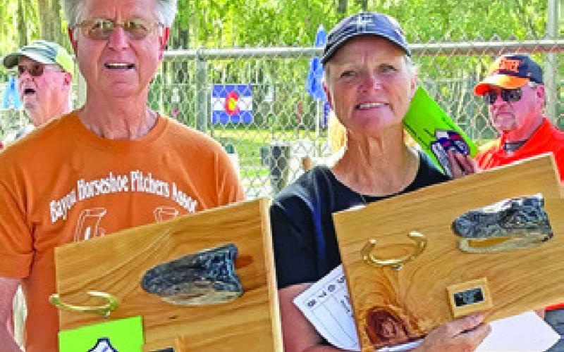 DORIS HIEDEN won the Class A 30-foot titles at the Cajun Coast Classic Horseshoe Tournament in Morgan City, Louisiana, and the doubles title at the Cajun Hi Lo Doubles on the Bayou Tournament in Patterson, Louisiana. She is pictured with doubles partner Clyde Landry.