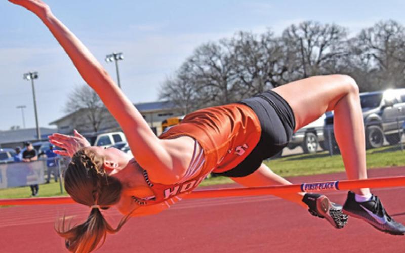 CALDWELL’S RYAN FERGUSON jumps for a bronze medal in the high jump at last week’s Koppers Relays. -- Tribune photo by Roy Sanders