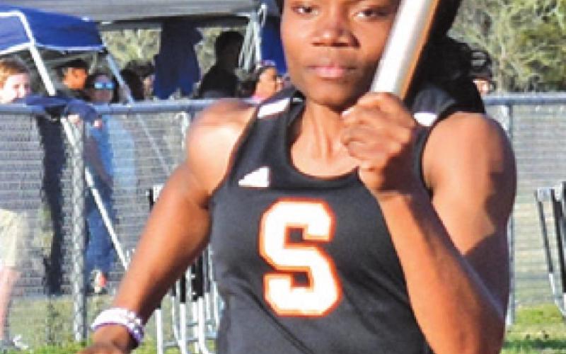 CAMIA MARTIN runs for the Somerville girls’ relay teams during the Koppers Relays.