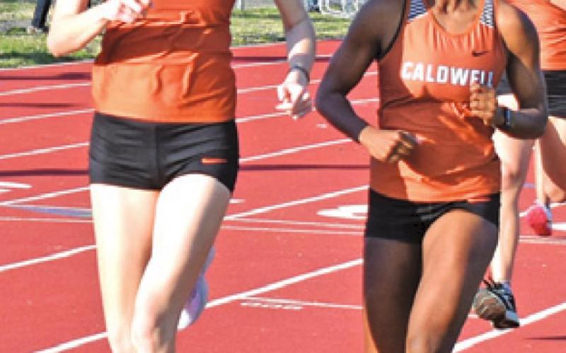 RYAN FERGUSON and Daisha Denson compete during the 800-meter run at the Koppers Relays. Also pictured is Isabel Alcocer.