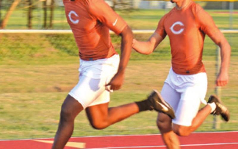 CALDWELL’S JAMAR HEWITT and Ivan Granados have a clean baton pass during the Koppers Relays. -- Tribune photo by Roy Sanders