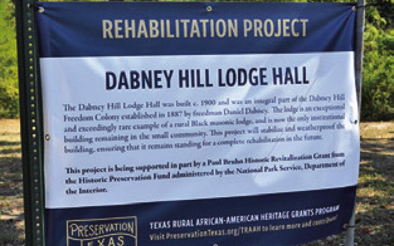 PRESERVATION TEXAS provided this sign, which sits at the entrance to the church and lodge, and explains the ongoing restoration project. Tribune photo by Sabine Lazo
