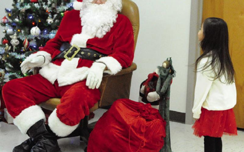 ST. BENEDICT KJT SOCIETY #100 sponsored “Breakfast with Santa” on Saturday at St. Mary Catholic Church’s Parish Activity Center. Santa sightings will continue this weekend with “Christmas on the Square,” “Breakfast with the Claus’” and “Santaville.” Tribune photo by Denise Squier