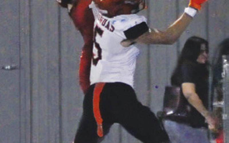 KYLE BROOKS of Somerville breaks up this Burton pass. Somerville won 42-41 in OT. Tribune photo by Denise Squier