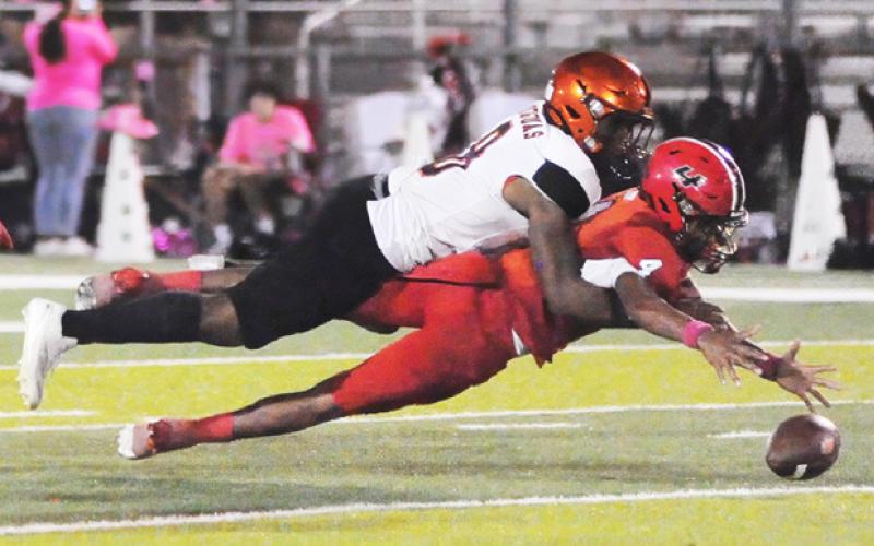 KEKE DANIELS FIGHTS FOR a fumble last Friday in Somerville’s win over Burton. Tribune photo by Denise Squier