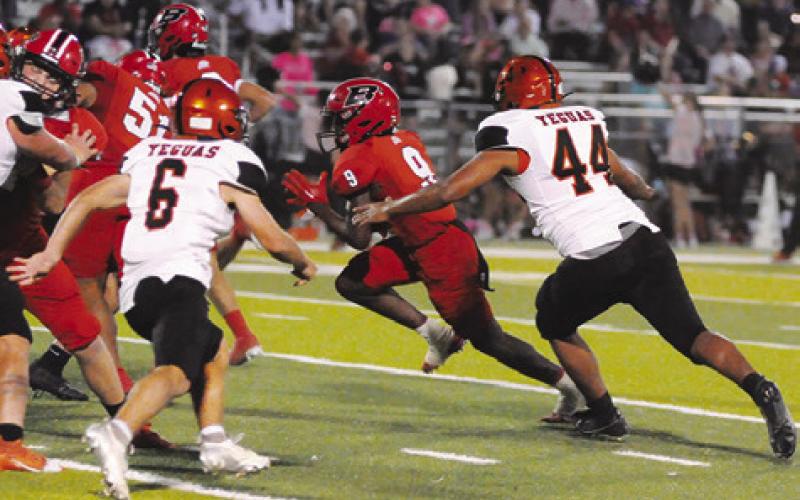 SOMERVILLE’S DECHRISTIAN Deere, right, and Colt Holton, left, move in for the tackle against Burton last Friday. Tribune photo by Denise Squier