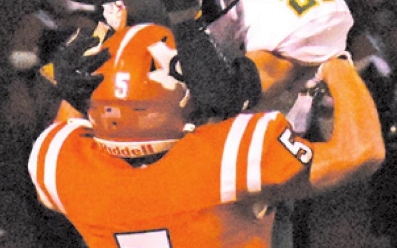 CALDWELL’S JACE ALY challenges Academy’s Zane Clark for possession of the ball.
