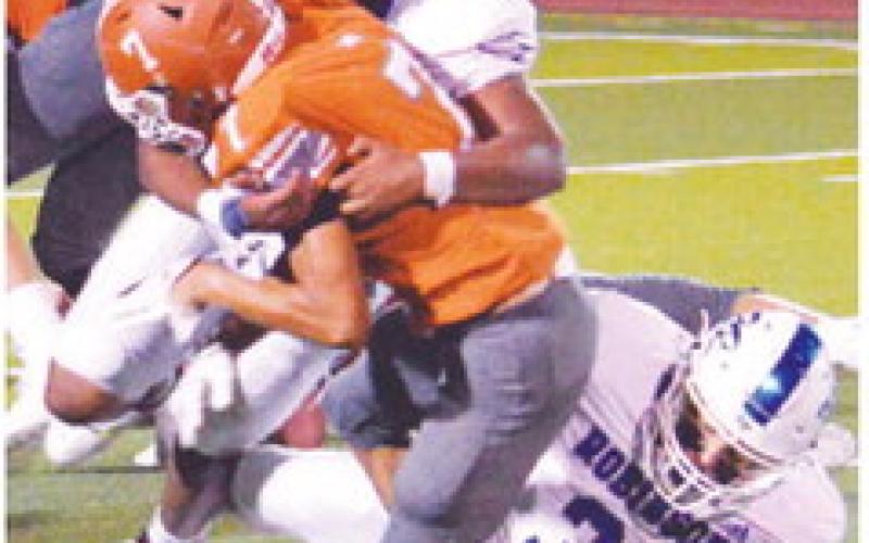 THE BALL IS fumbled as a Robinson defender tackles Caldwell’s E.J. Rogers. -- Tribune photo by Roy Sanders