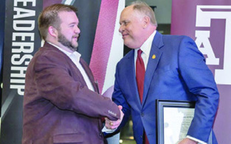 CLUB FOUNDER and President, Trey Groce, left, accepts Burleson County A&amp;amp;M Club’s Charter from Porter S. Garner, Association of Former Students President, at the 2024 Fall Leadership Reception on Friday, November 15. Photo courtesy of The Association of Former Students