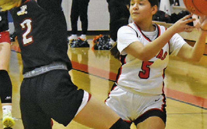 EMILY GARZA LOOKS for help during the Somerville-Burton game last Friday night. Tribune photo by Roy Sanders