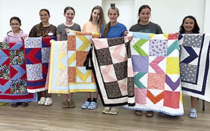 CREATIVE MEMORIES QUILT Guild recently held a youth camp and pictured above are the camper’s with their quilts. Pictured, from left, are Alexandra Ruiz, Elisa Brinck, Kathryn Schilling, Sawyer Vann, Emma Raymond, Ashlin Albright and Adelina Gallegos.