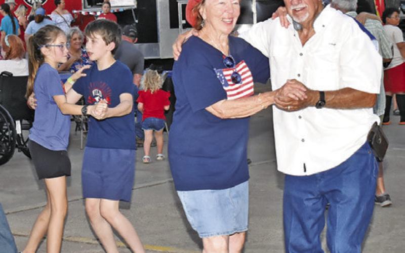 DANCERS HAVE FUN at the July 3 celebration at Elizabeth Lutheran Church in Caldwell. Music was provided by the Crossroads Band.