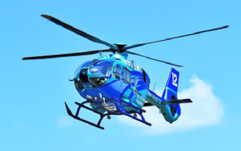 AN AIRMED helicopter crew lifts off on Sunday from State Highway 36 South. Tribune photo by Roy Sanders