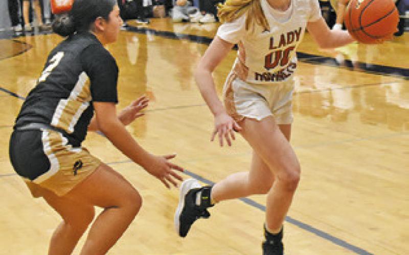 IRELAND MORGAN dribbles past a Giddings player during Caldwell’s 42-34 home win over the Lady Buffs last Friday night. Tribune photo by Roy Sanders