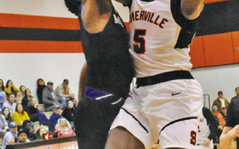 KEITH CRAWFORD of Somerville takes a shot against Mumford in the regular season finale. -- Tribune photo by Roy Sanders