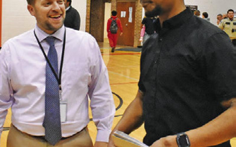SNOOK SUPERINTENDENT Eric Holton congratulates Somerville Head Coach Terrance Preston after the Mumford victory.