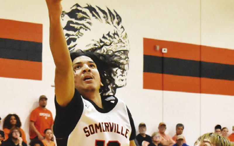 GARDNER SHIVERS OF Somerville takes a shot against Mumford. Somerville won 70-53. -- Tribune photo by Roy Sanders