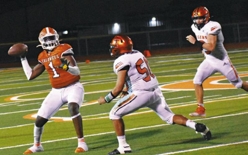 CALDWELL’S TAVAREAN GRIMES throws this pass last Friday against Smithville in the season finale. -- Tribune photo by Roy Sanders