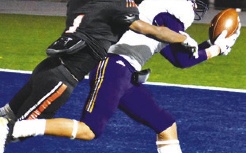 SOMERVILLE’S HERSCHEL Conway dives to make the tackle after this Granger catch. -- Tribune photo by Roy Sanders