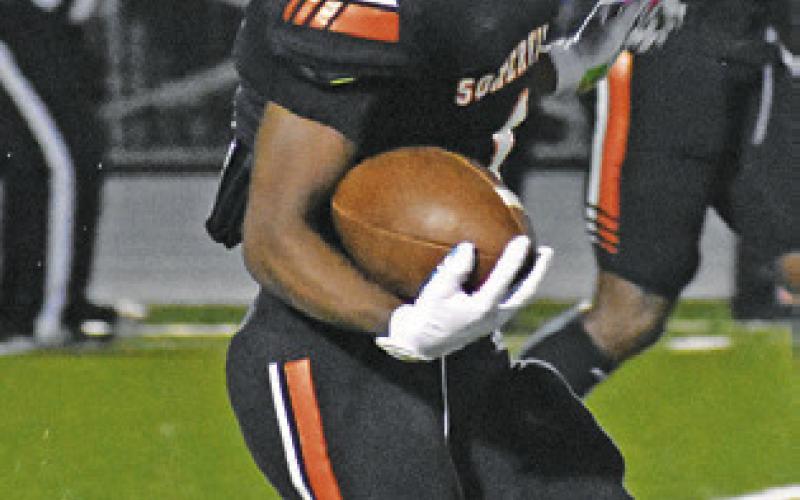HERSCHEL CONWAY carries the ball for the Somerville Yeguas against Granger.