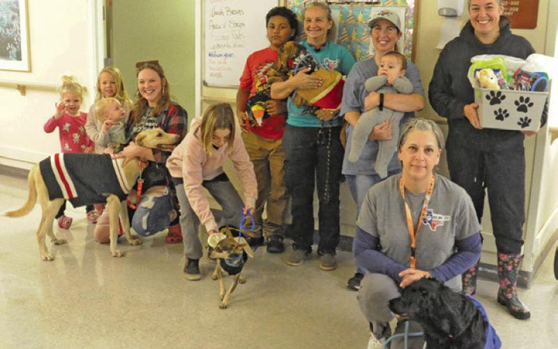 LOCAL RESIDENTS AND MEMBERS of Haven Animal Rescue of Texas (HART) brought dressed up dogs for a “Dog Parade” at Burleson Manor last Thursday afternoon. Tribune photo by Denise Squier