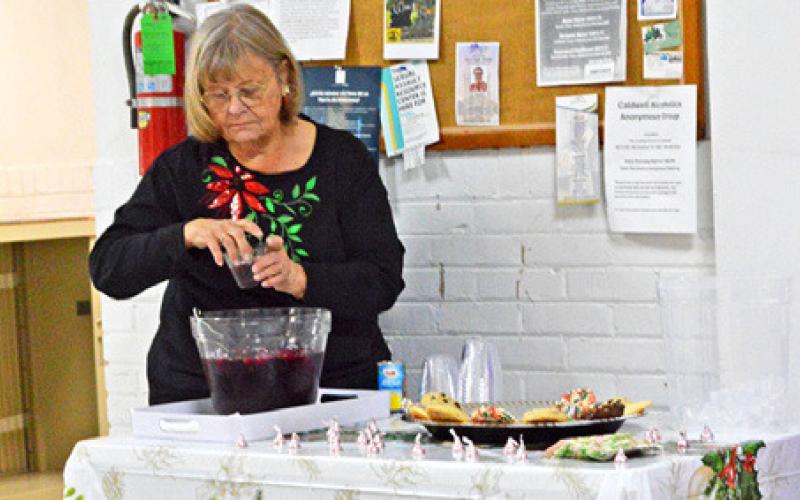 THE HISTORICAL COMMISSION offered snacks and refreshments at its Museum Open House on Friday, Dec. 19. Tribune photo by Sabine Lazo