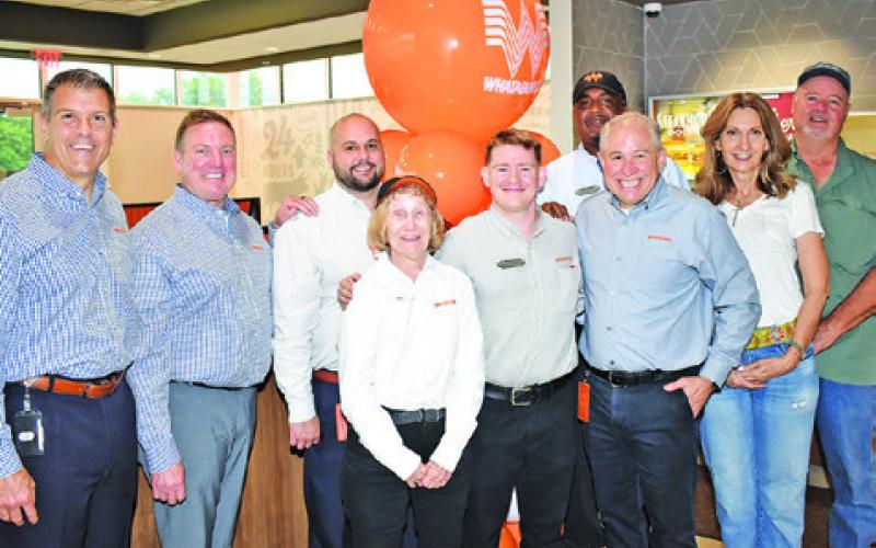 ED NELSON, NATIONAL CEO and president of Whataburger, visits the Whataburger on Wednesday, May 1, in Caldwell. Pictured from left are Jeff North, company brand leader, Tim Fisher, vice president of operations, Zach Udall, marketing leader, Doris Broaddus, employee, Justus Lumpkins, operating partner, Gary Harrison, manager, Nelson, and Bruce and Cindy Alford of Caldwell. -- Tribune photo by Roy Sanders