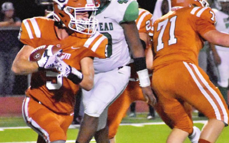JACE ALY OF Caldwell carries the ball against Hempstead last Friday. Caldwell won 38-6. -- Tribune photo by Roy Sanders