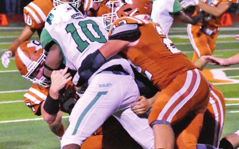 THE CALDWELL HORNET defense brings down this Hempstead ball carrier. Caldwell won 38-6. -- Tribune photo by Roy Sanders