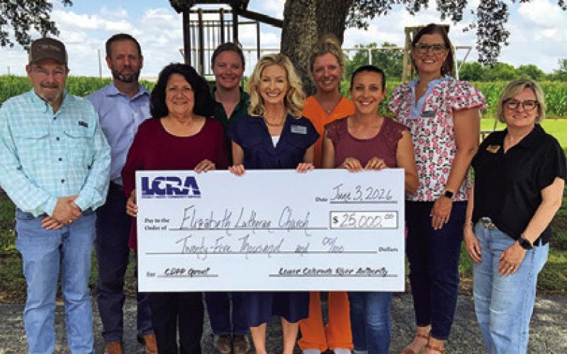 MEMBERS OF THE ELIZABETH Lutheran Church in Caldwell’s playground committee and LCRA gather to celebrate the $25,000 community grant. Photo courtesy of LCRA