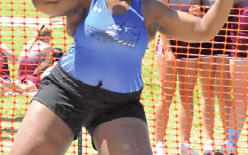MIRACLE HILL tosses the shot put to earn fourth place at last week’s district track meet.