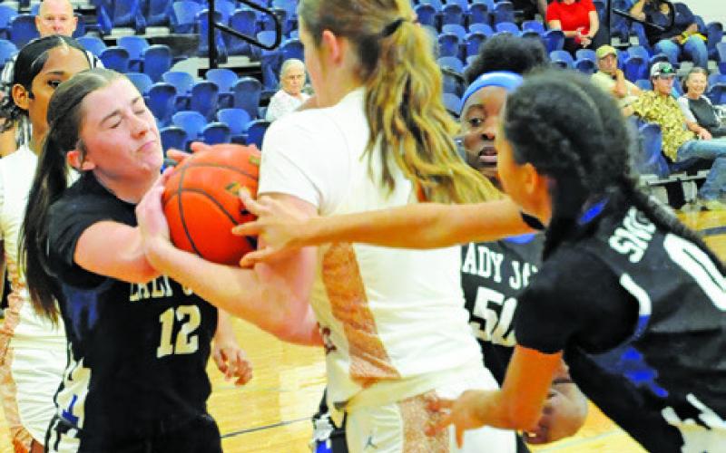 SNOOK’S KILEY PRICE BATTLES with Caldwell’s Lydia Giese for possession of the ball during the Snook-Caldwell game last Tuesday. Tribune photo by Denise Squier