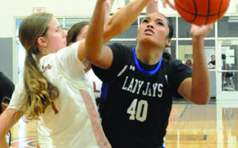 THOUGH SNOOK rallied, Caldwell held on to win last Tuesday at Hornet Gym. Tribune photo by Denise Squier