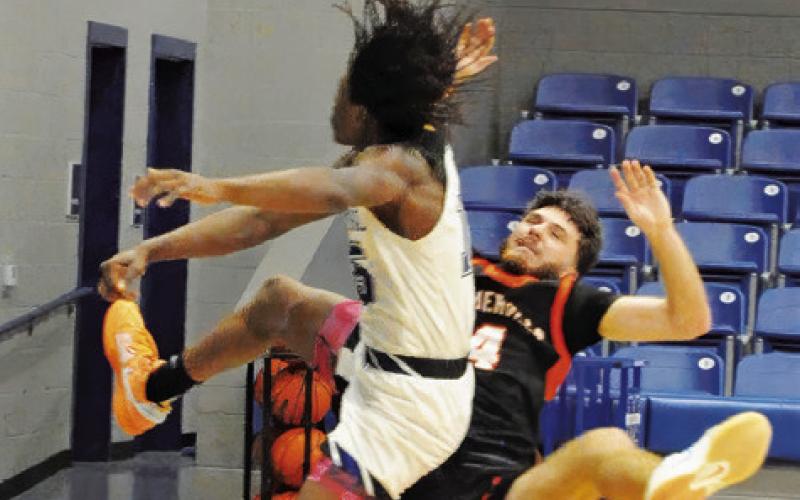 SOMERVILLE’S KASON ROHRBACH fights for ball against Mumford. Tribune photo by Denise Squier