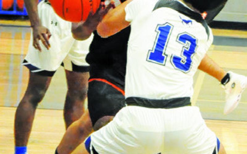 SOMERVILLE’S JA’KEITH Daniels fights for the ball against Mumford last Friday. Tribune photo by Denise Squier