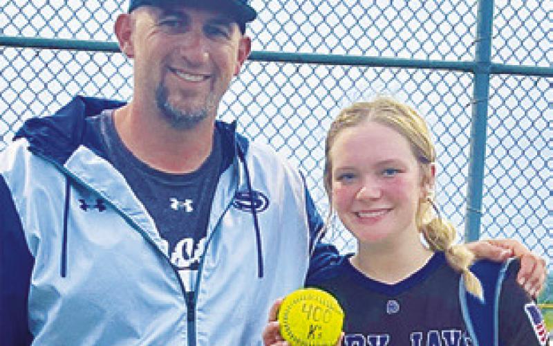 SNOOK PITCHER Aubrey Becker earned her 400th career strikeout last Tuesday against Iola. She is pictured with Snook Coach Dylan Conway.
