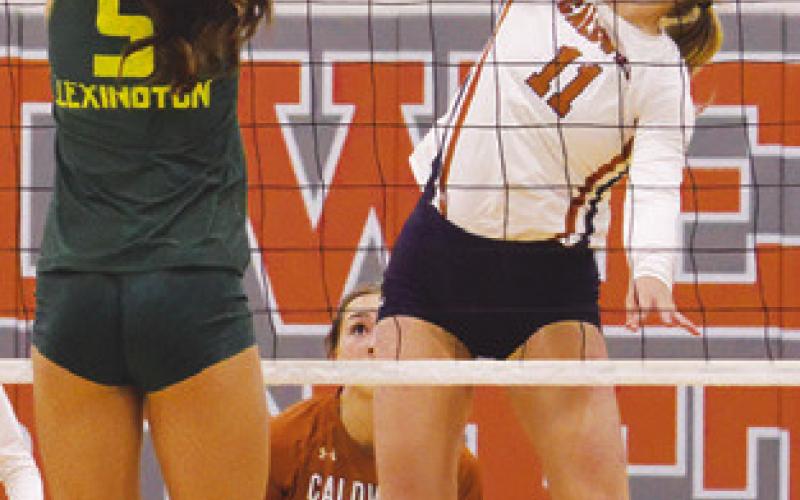 REESE MCMANUS gets one of her six kills during the Caldwell-Lexington match on Friday at Hornet Gym. Tribune photo by Kimberly Hutcheson