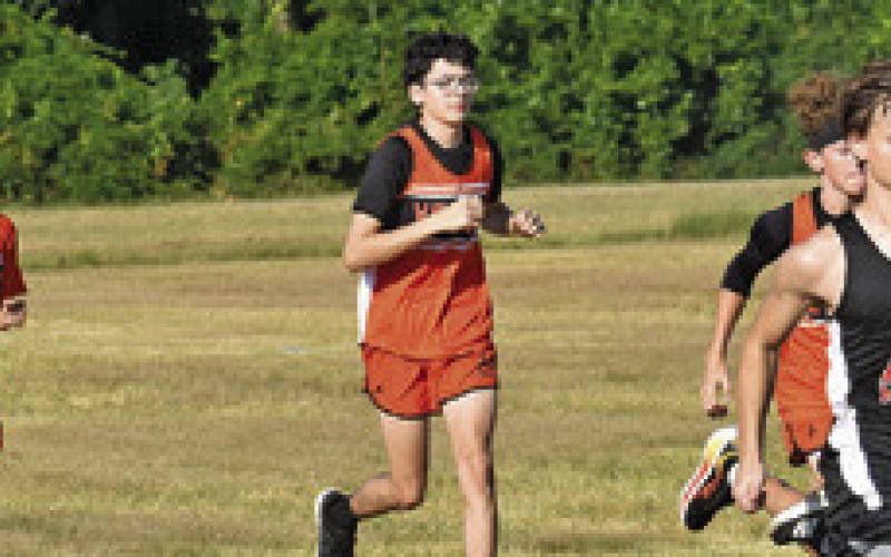 THE RUNNING YEGUAS cross country team runs during the boys JV race at Saturday’s Caldwell XC Invitational. Tribune photo by Roy Sanders